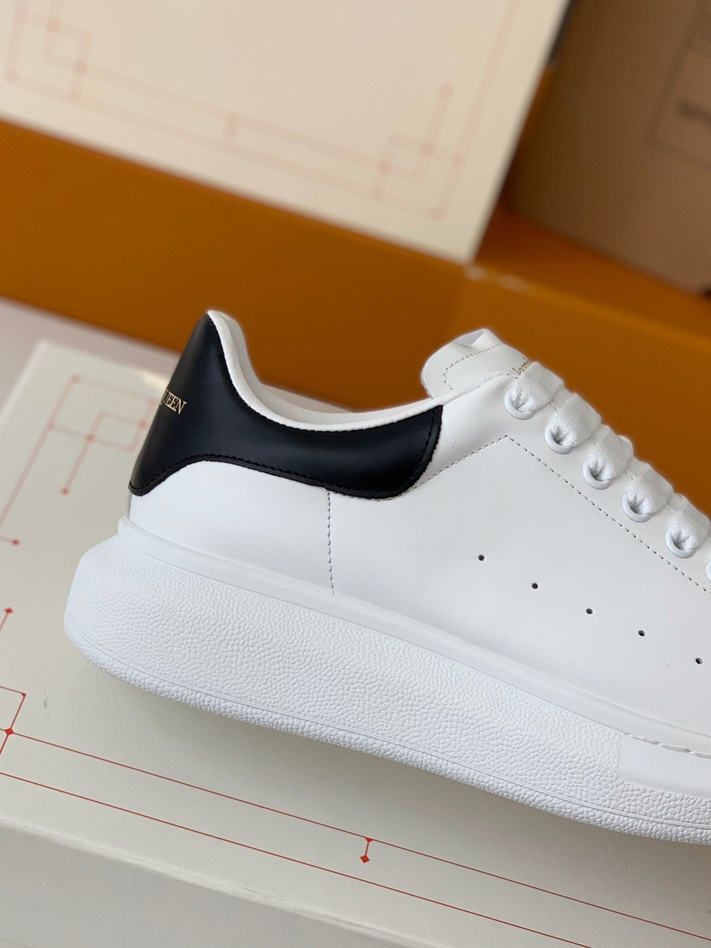 Alexander McQueen Men’s White Leather Oversized Sneakers with Black Heel Tab