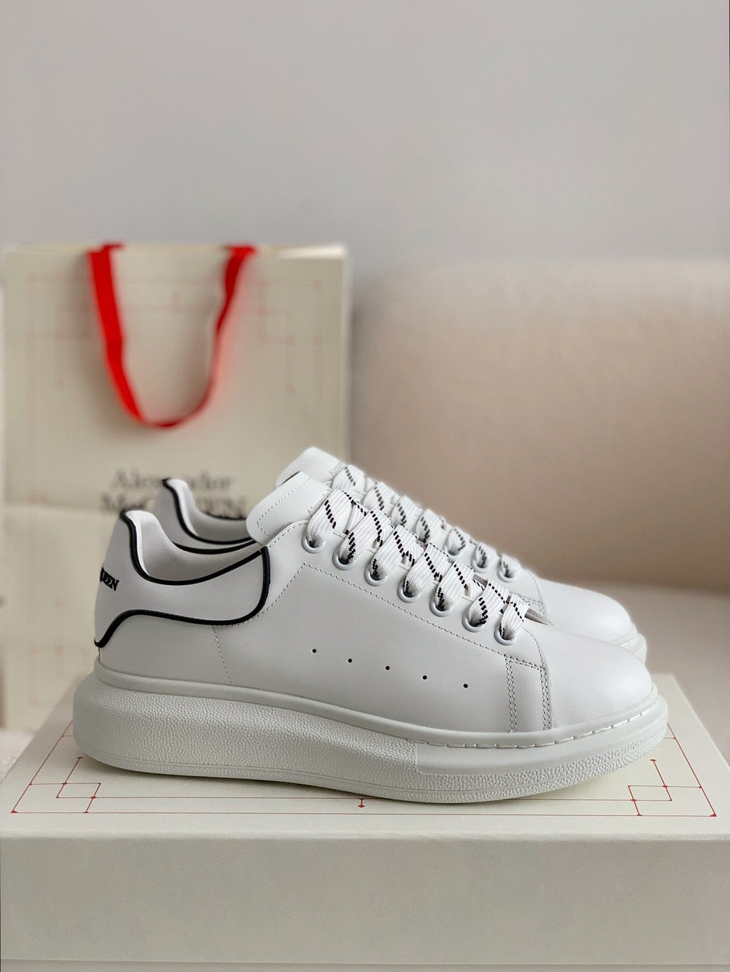 Alexander McQueen Men’s White Leather Oversized Sneakers with Black Piping Detail