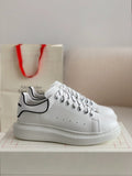 Alexander McQueen Men’s White Leather Oversized Sneakers with Black Piping Detail