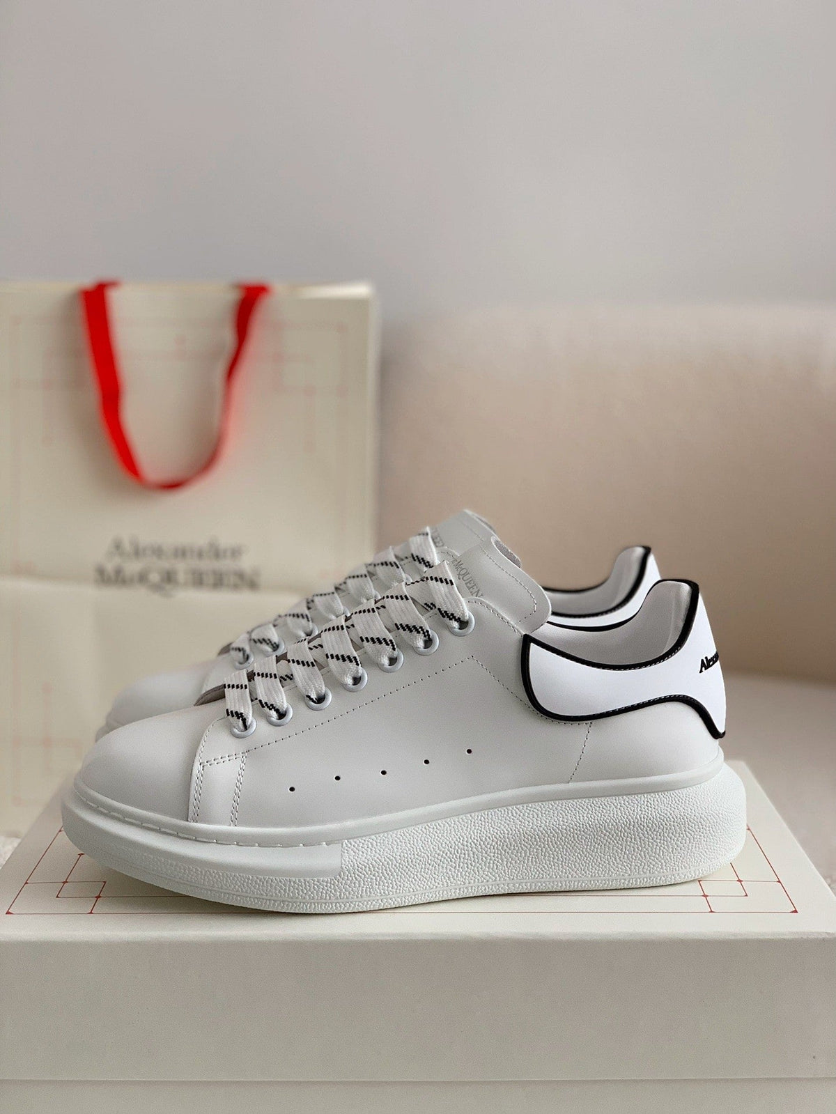 Alexander McQueen Men’s White Leather Oversized Sneakers with Black Piping Detail