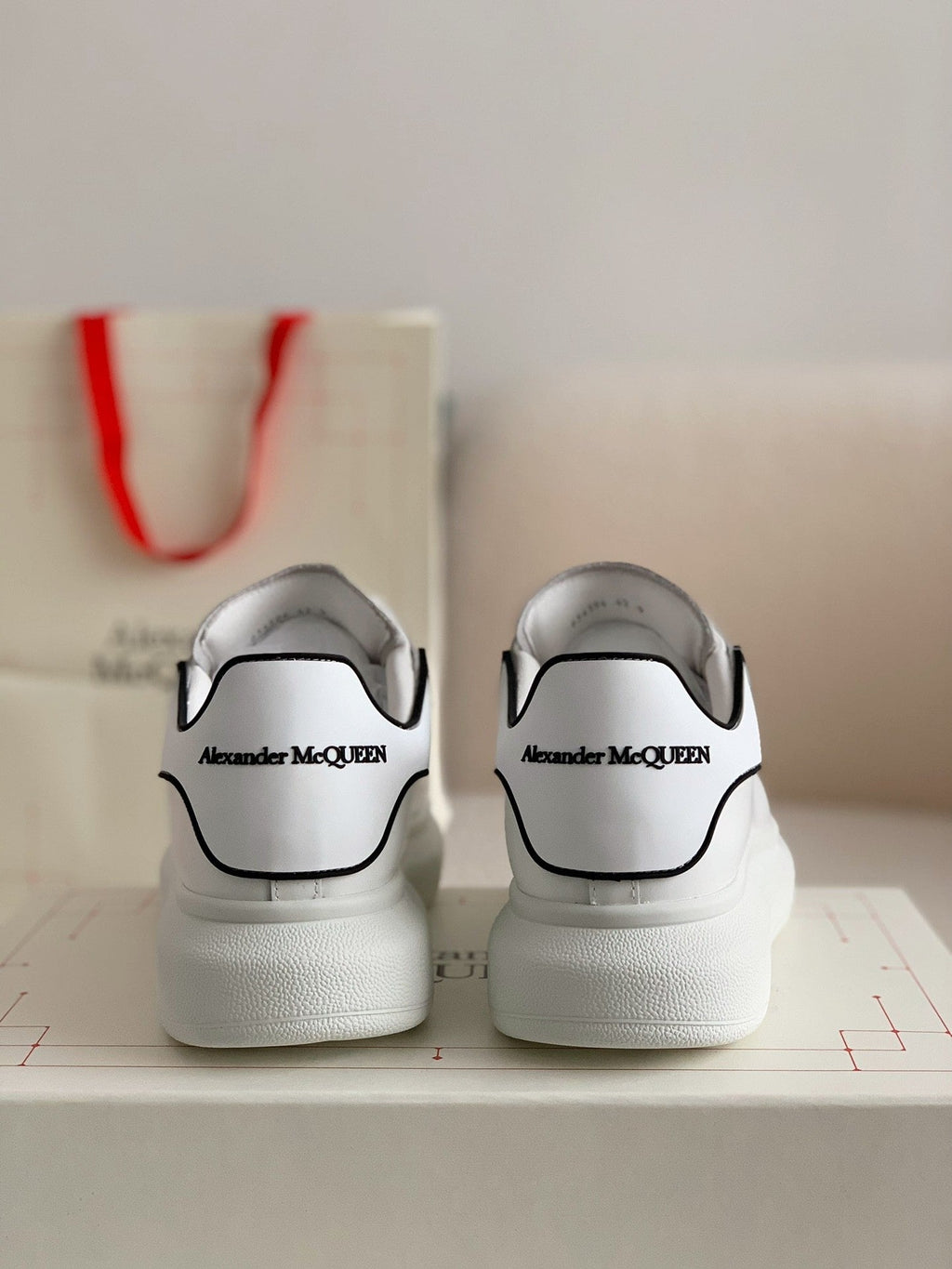 Alexander McQueen Men’s White Leather Oversized Sneakers with Black Piping Detail