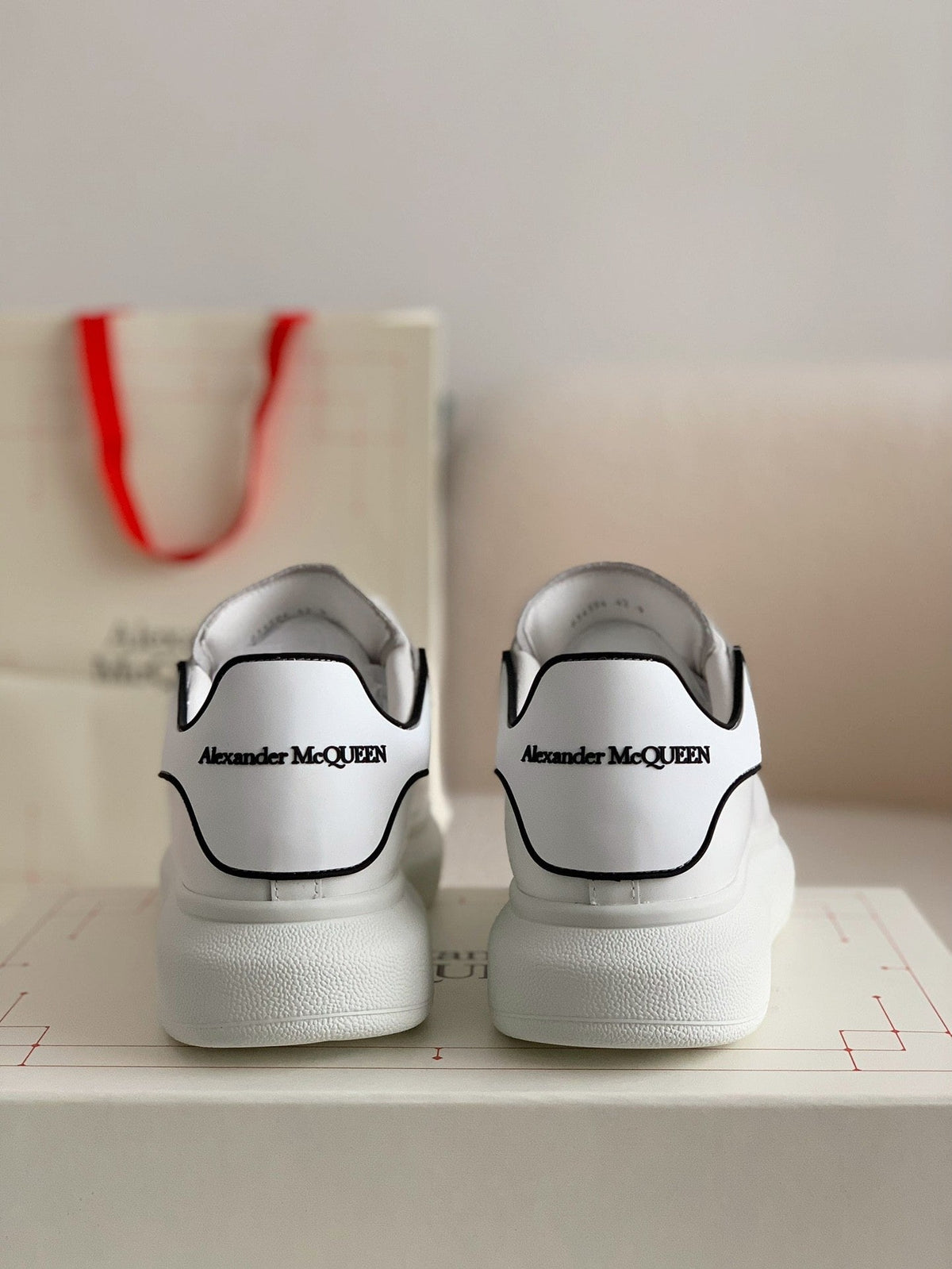 Alexander McQueen Men’s White Leather Oversized Sneakers with Black Piping Detail