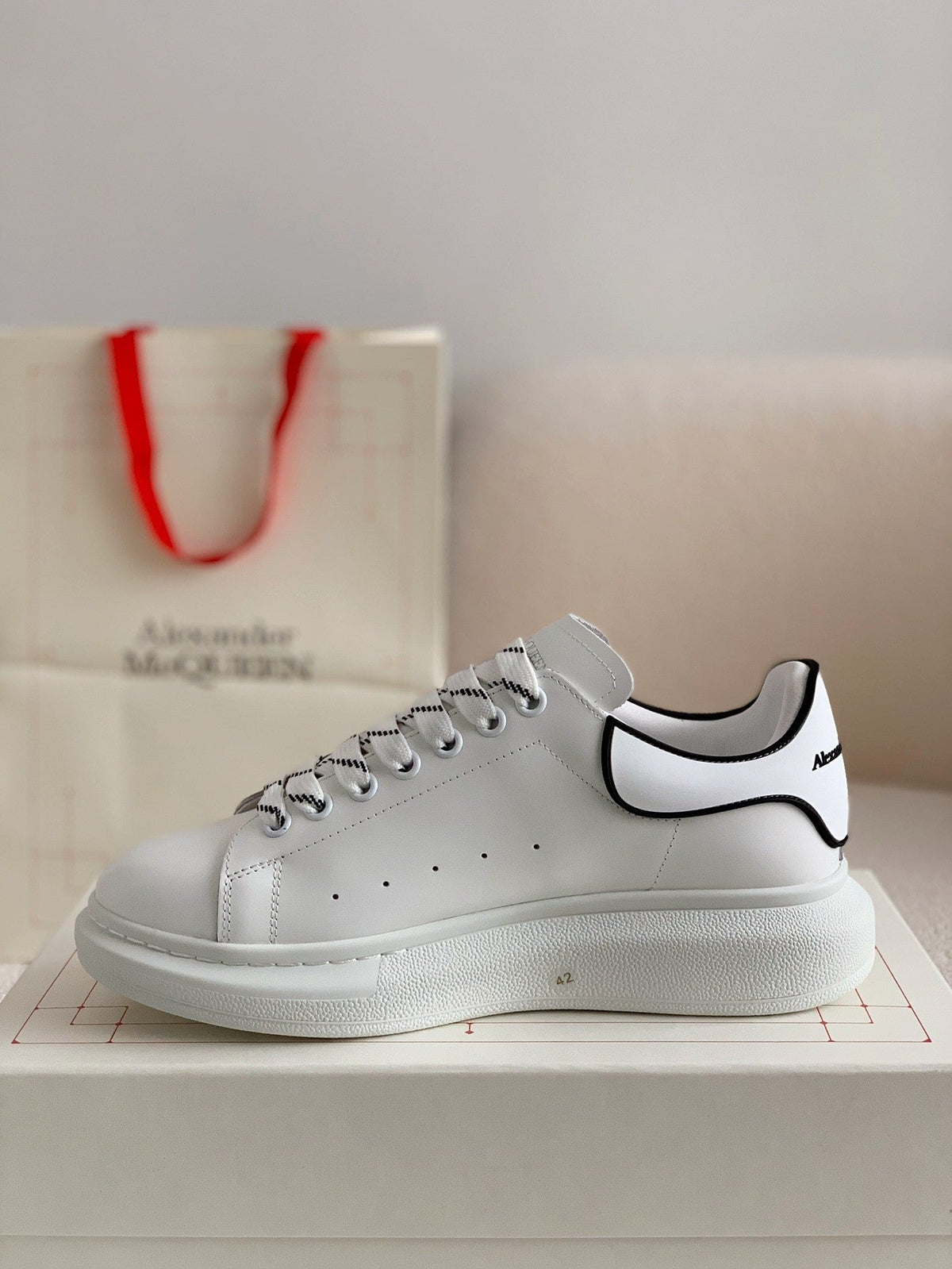 Alexander McQueen Men’s White Leather Oversized Sneakers with Black Piping Detail