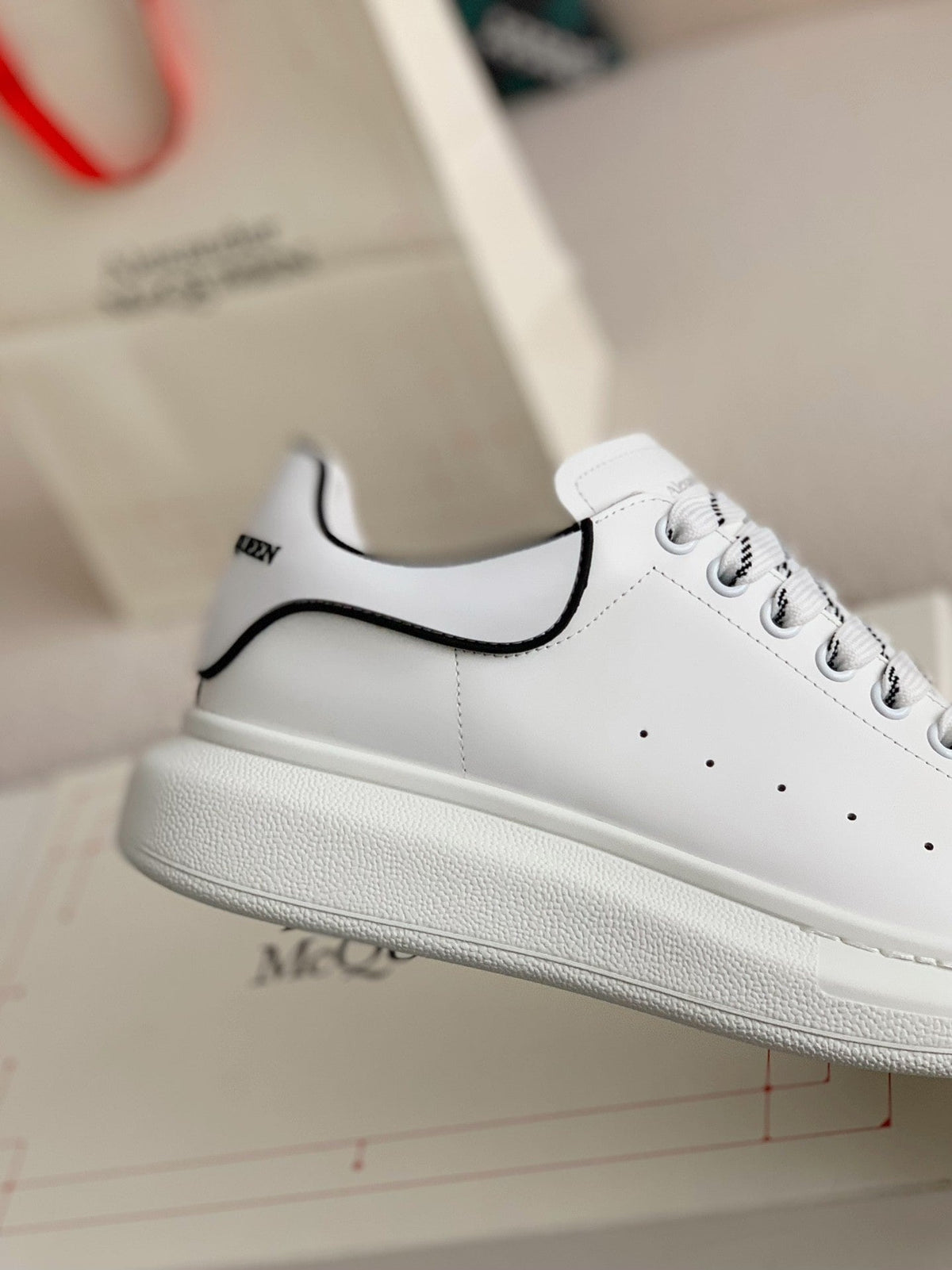 Alexander McQueen Men’s White Leather Oversized Sneakers with Black Piping Detail