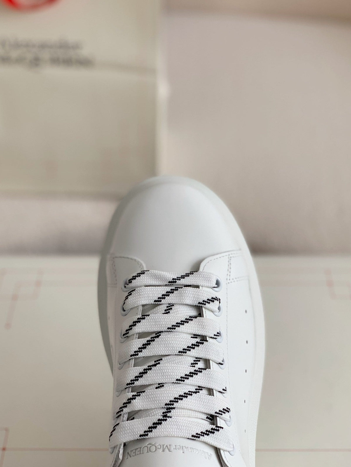 Alexander McQueen Men’s White Leather Oversized Sneakers with Black Piping Detail