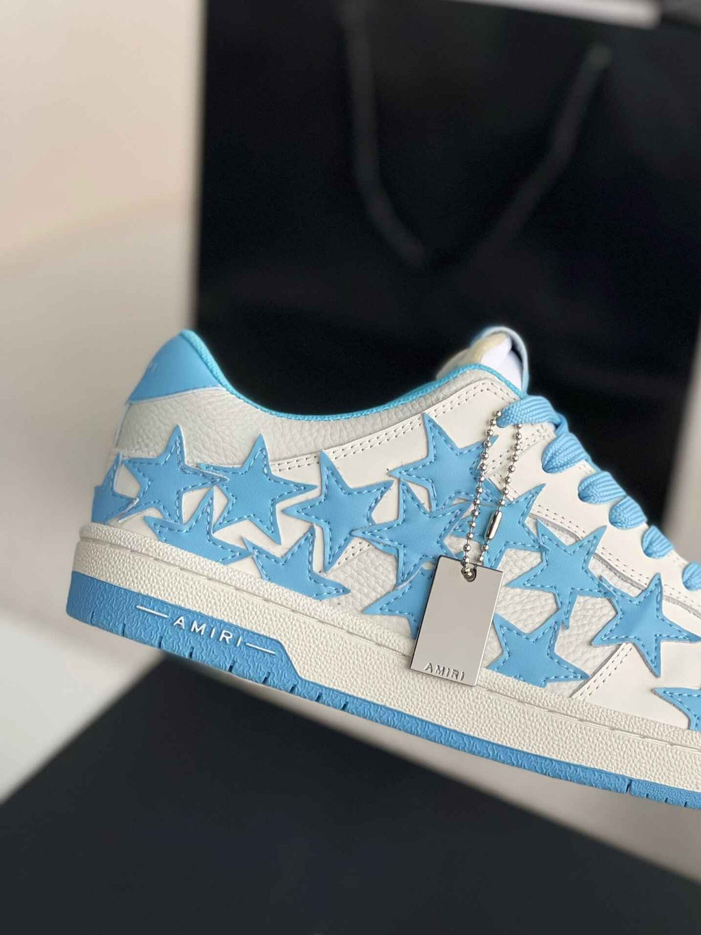 Amiri Star Burst Low – White Grained Leather & Sky Blue Stars