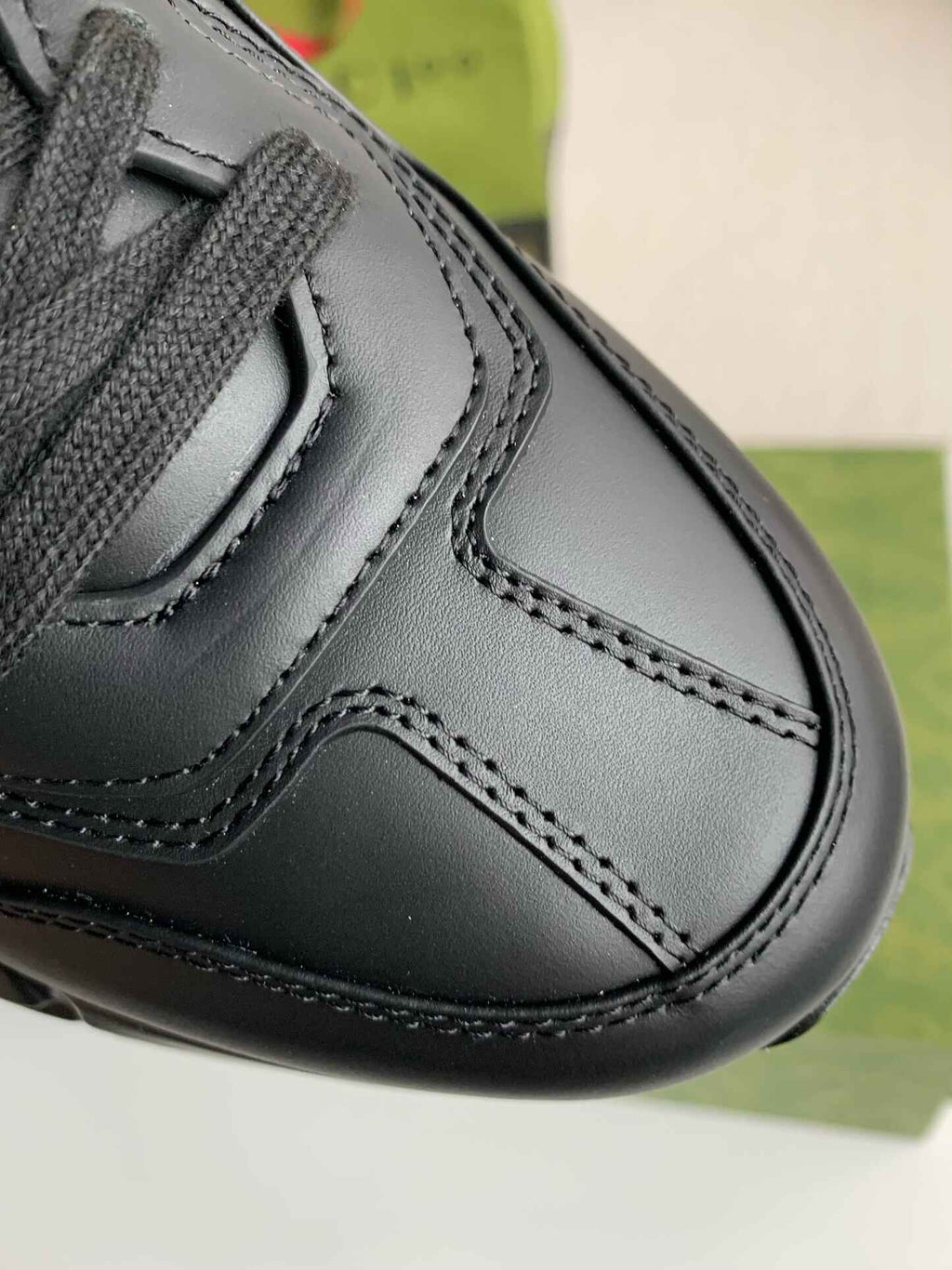 Gucci Rhyton Sneaker – Black Leather with White Interlocking G